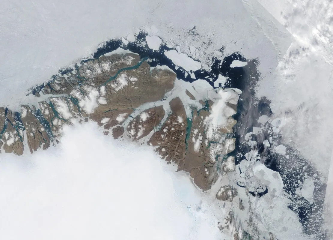 True-color composite image taken by the NASA Moderate Resolution Imaging Spectroradiometer (MODIS) sensor shows sea ice as seen from an aircraft over Peary Land, Northeast Greenland.