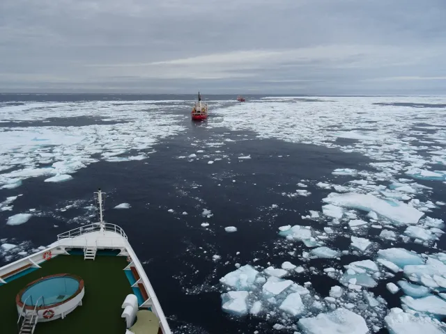 Cool photo of sea ice and ships going through the channel of ice.