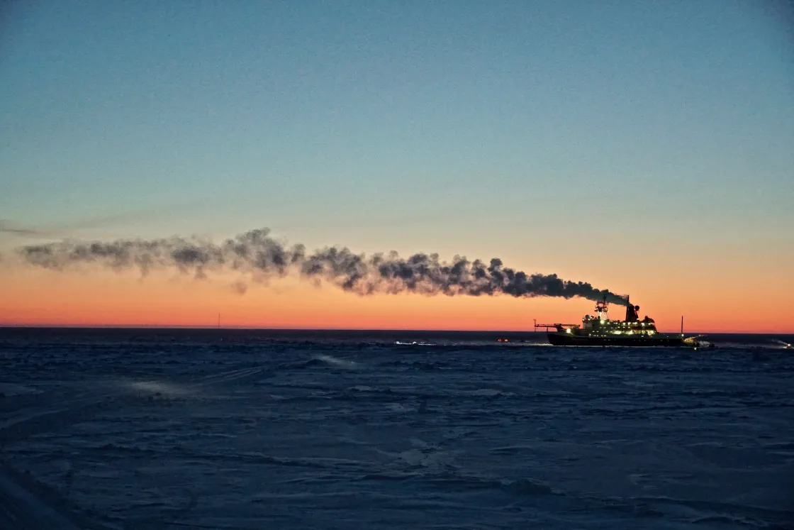 The German icebreaker Polarstern drifts with the sea ice, where it has been lodged since September 2019 as part of the Multidisciplinary drifting Observatory for the Study of Arctic Climate (MOSAiC) project. As the project heads into spring, a perpetual sunrise eclipses the horizon.