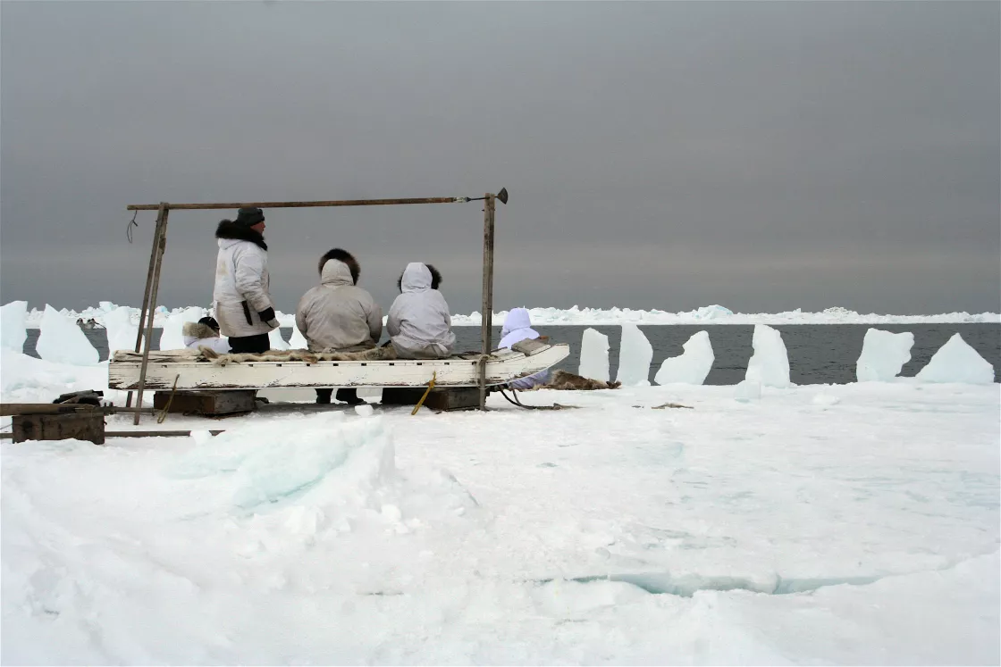 Whaling crew watches open waters. 