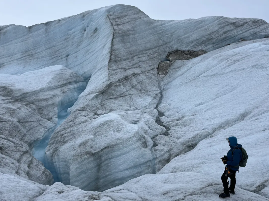 Researcher standing on uneven icy surface