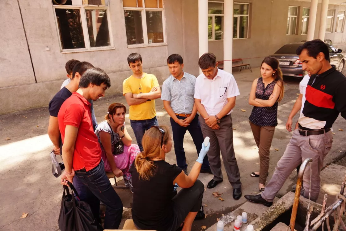 Alice Hill demonstrating proper water sampling