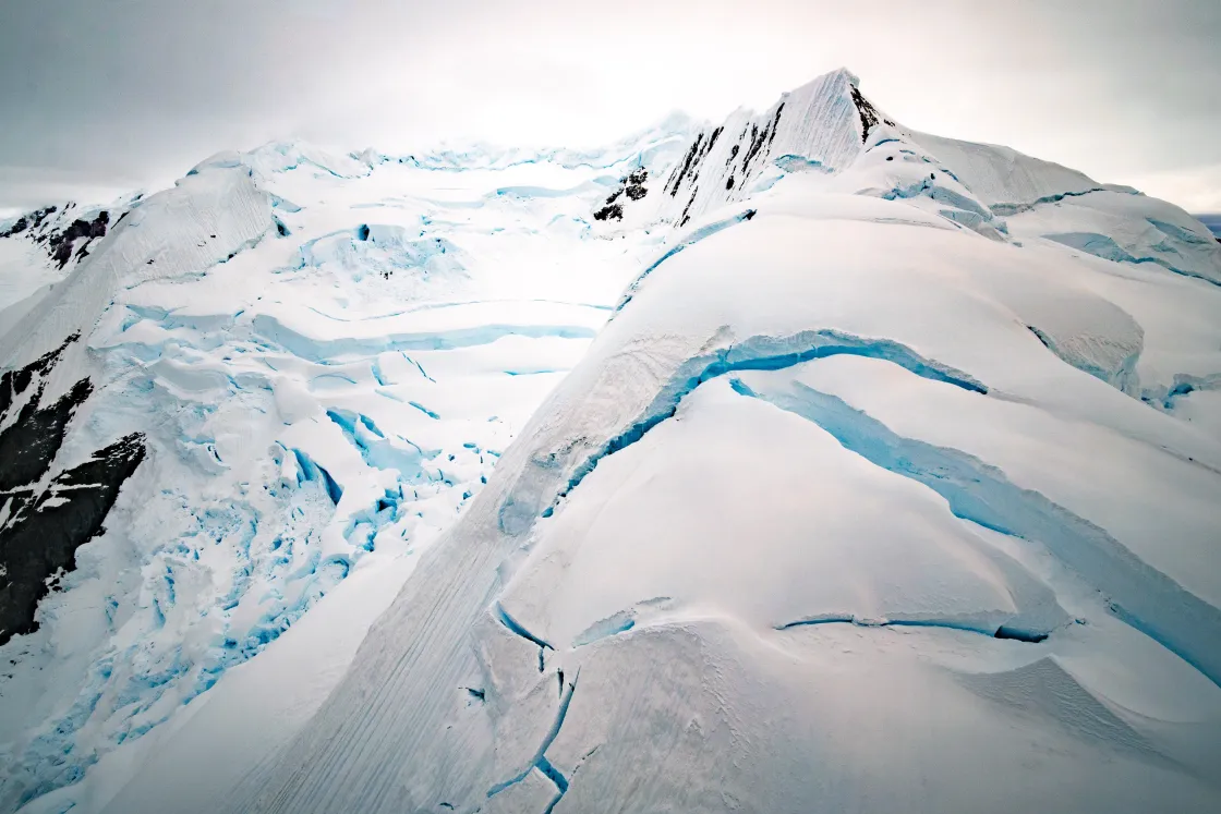 Aerial shot from helicopter over mountains near Paradise Bay, Antarctica