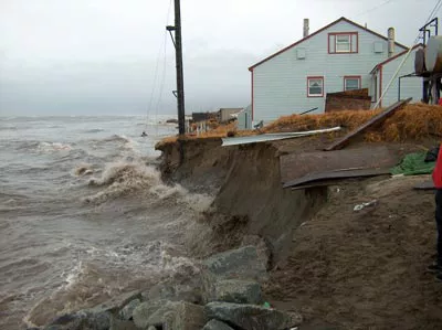 eroding coast and house in shishmaref, alaska