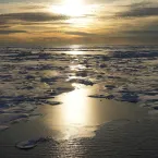 The sun sets over Arctic sea ice