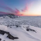 sea ice butts up to Greenland coast