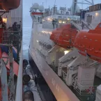 The Polarstern and the Fedorov sidled up to each other to exchange personnel and equipment via cranes on deck. Sea ice floats between them. Credit: Sean Horvath 